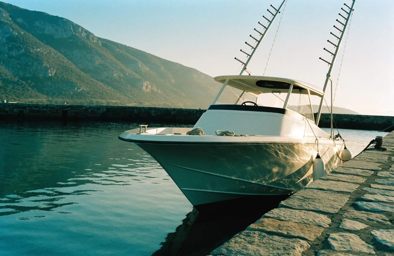 The boat alongside the harbour wall, rigged for the morning run.